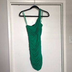 Green one shoulder form fitting dress with rouching